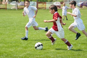 boys kicking ball